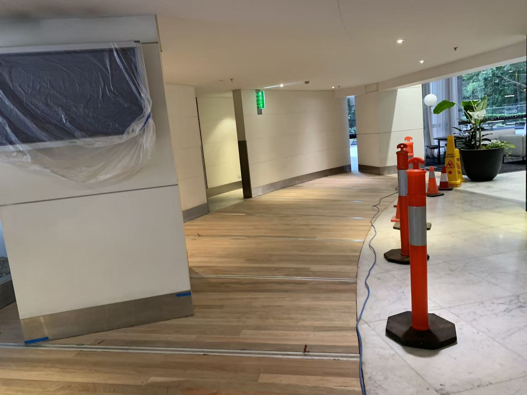 Building lobby timber floorboards freshly sanded, before staining, Sydney