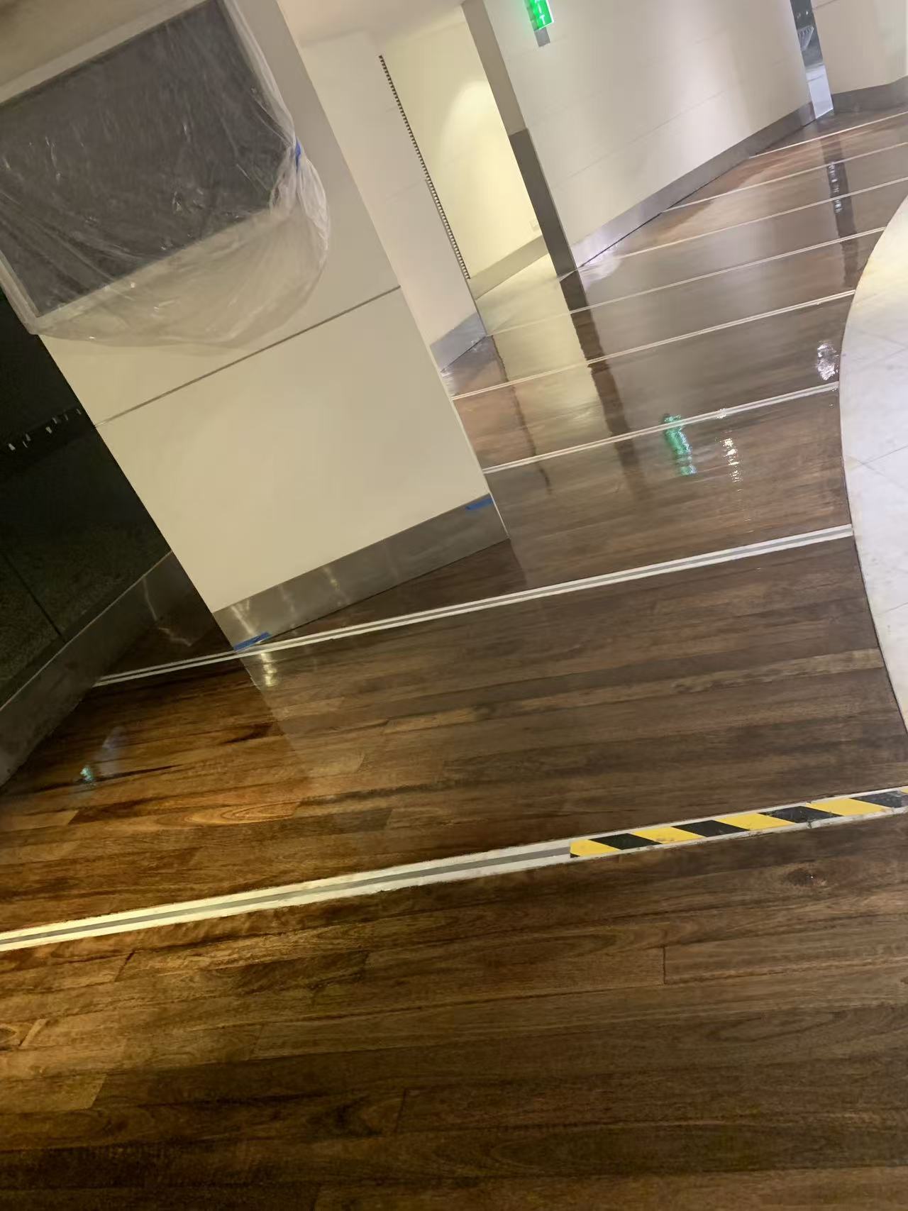 Building lobby timber floorboards, stained and polished to a gloss finish, Sydney
