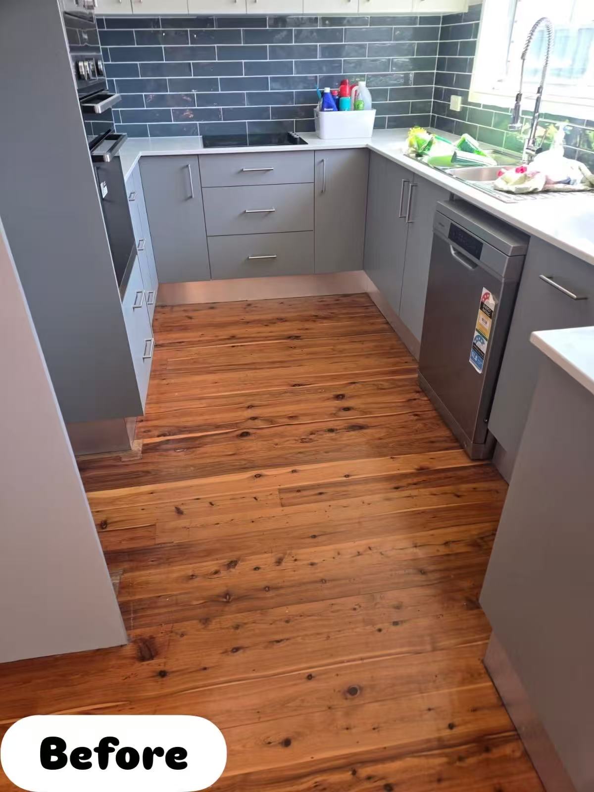 Old kitchen timber floorboards before sanding, dark worn finish, Terrigal