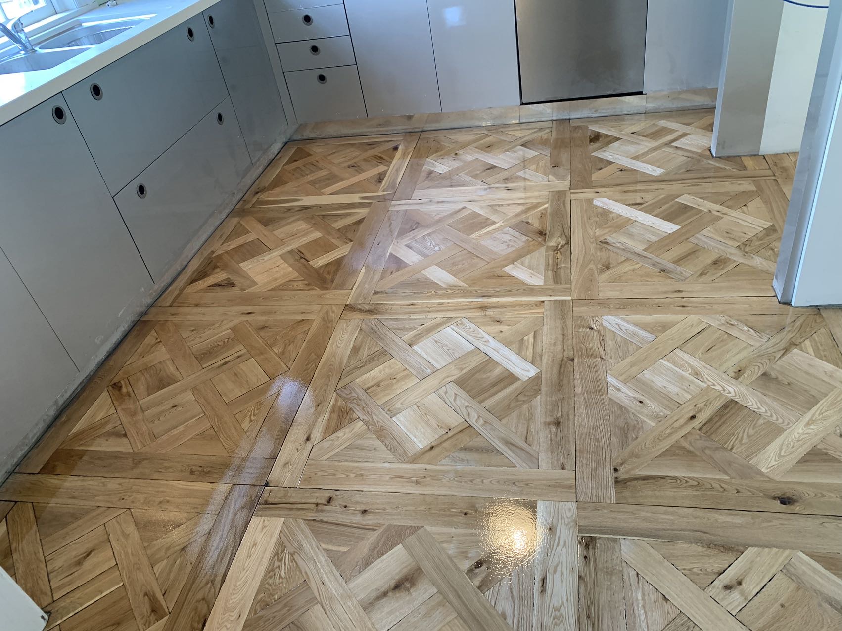 Restored herringbone parquetry timber floor, natural tone