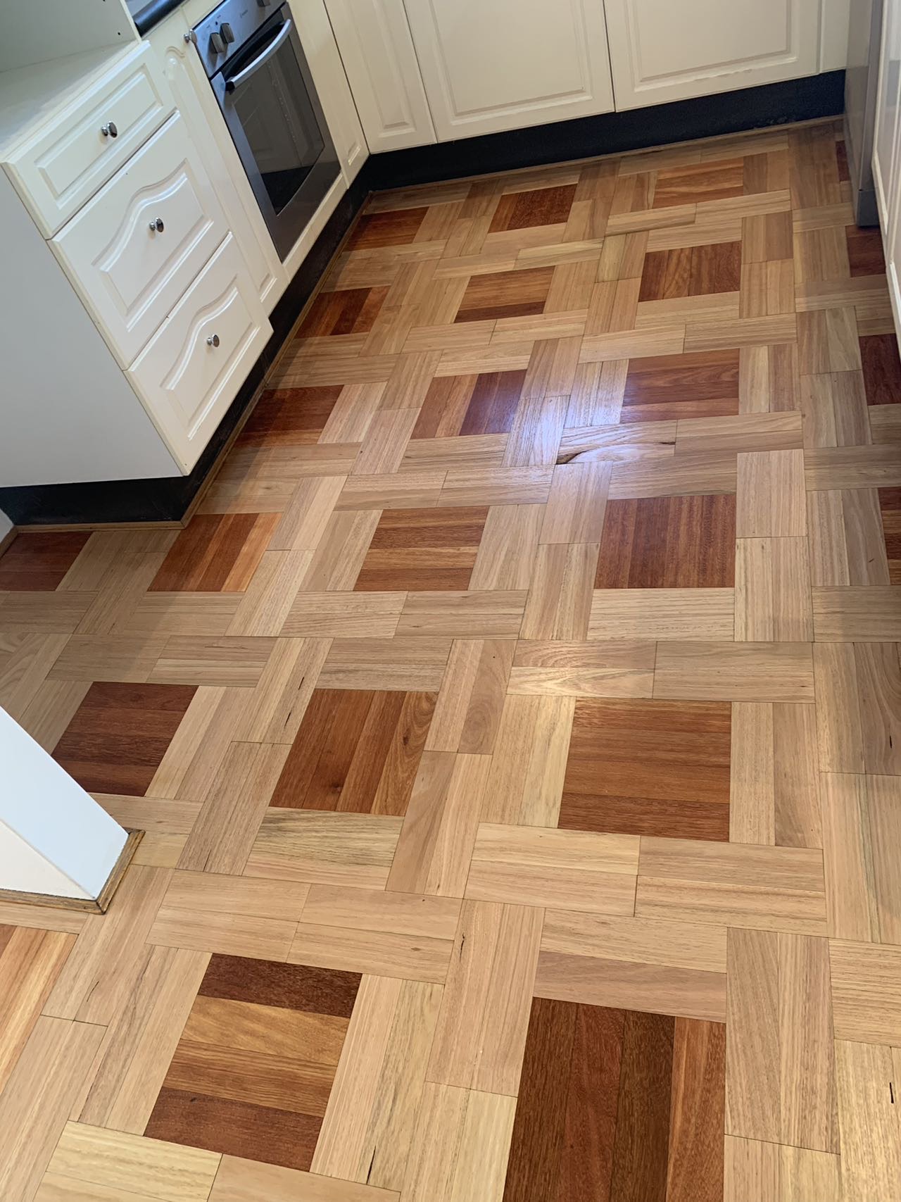 Restored basket-weave parquetry timber floor, mixed tones