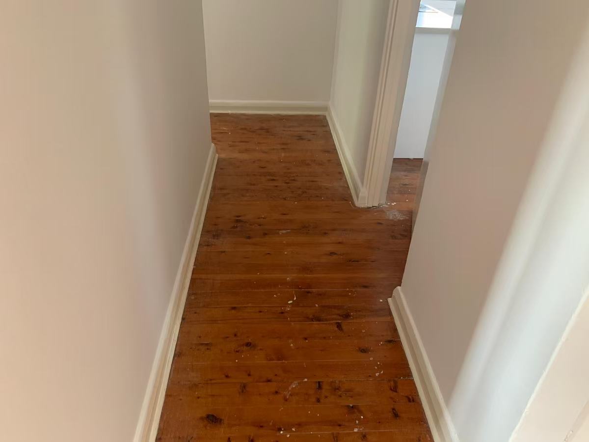 Old worn hallway timber floorboards before sanding, Eastwood