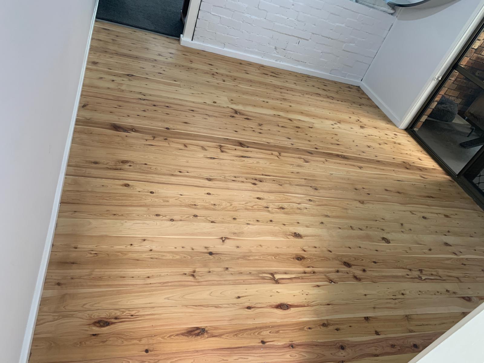 Living room timber floor finished, fireplace, Jervis Bay