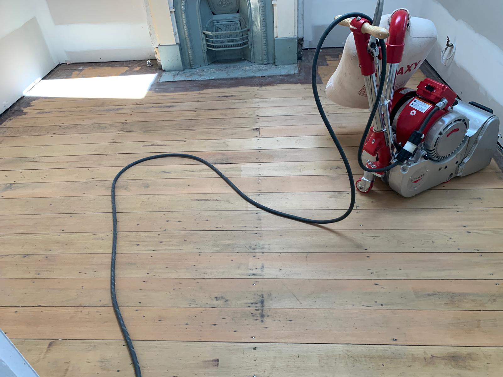 Timber floor mid-sand with sanding equipment, fireplace room, St Peters